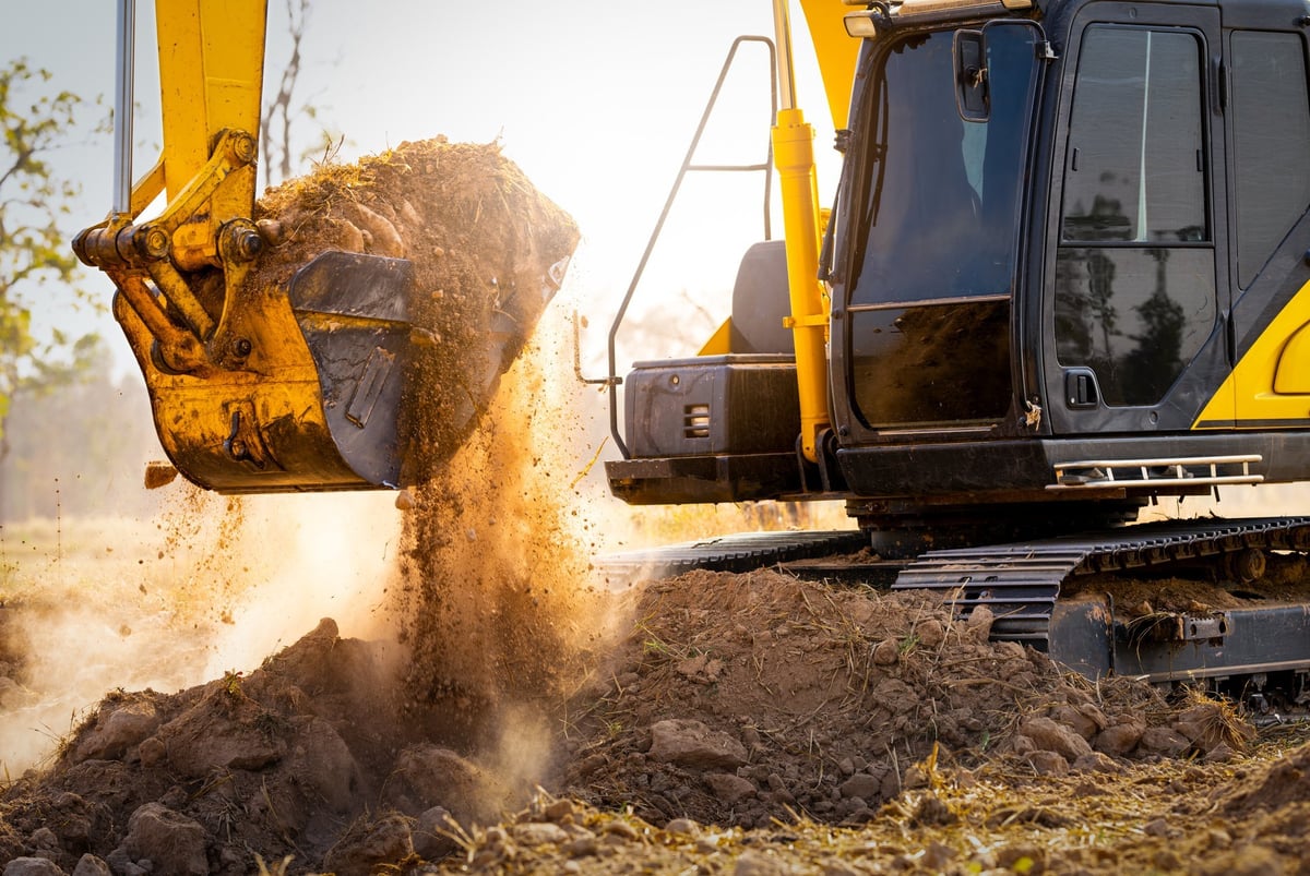 Excavator digging soil during earthworks in Geelong