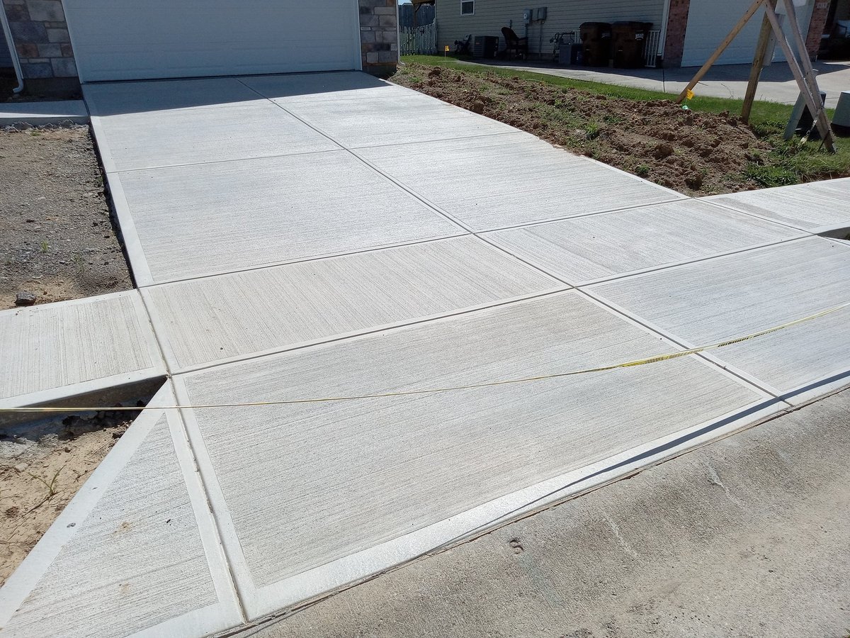 Home under construction on a prepared pad and driveway site